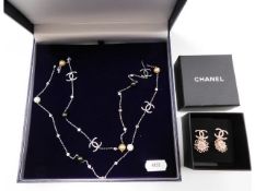 A Chanel style necklace twinned with a pair of boxed Chanel earrings