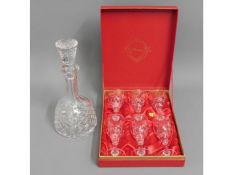 A cut glass decanter twinned with a boxed set of c