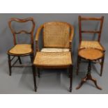 A cane tub chair twinned with other cane seating &