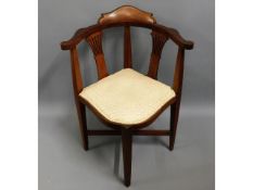 An arts & crafts style Edwardian mahogany corner c