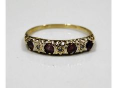 A 9ct gold ring set with small illusion set diamon