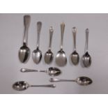 Nine silver spoons, including golf themed, 118.6g