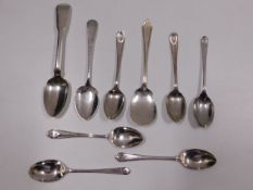 Nine silver spoons, including golf themed, 118.6g