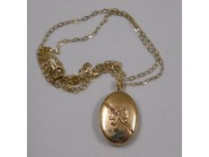 A 9ct gold chain & floral locket, 1.9g