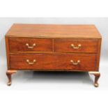 A low level mahogany chest of drawers with brass f