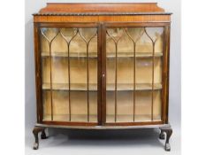 A mahogany display cabinet, faults to feet & lock,