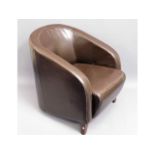 A upholstered leather tub chair