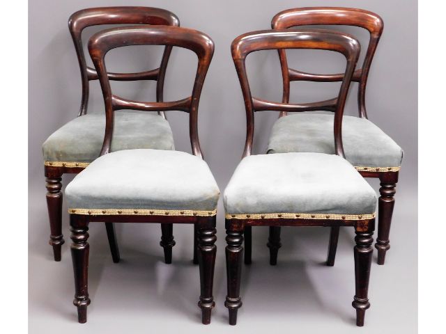 A set of four 19thC. mahogany balloon backed chair