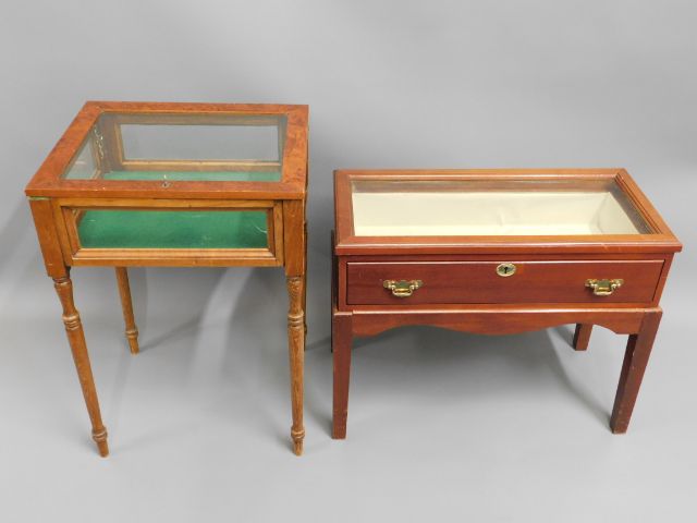 Two glazed display cases, one with crack to side,