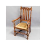 An oak throne style carver chair with barley twist