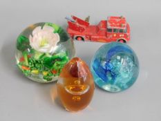 A Wedgwood paperweight, two other paperweights & a