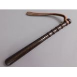 A hard wood police truncheon stamped NSC, 15in lon