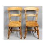 A pair of antique elm seated farmhouse chairs