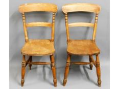 A pair of antique elm seated farmhouse chairs