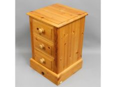 A pine chest of three drawers, 25.25in high