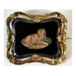 A mid 19thC. micro mosaic dog brooch depicting a s