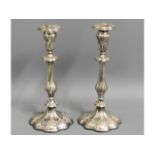 A pair of 19thC. silver plated candle sticks, 11.7