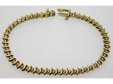 An 18ct gold tennis bracelet set with approx. 2.08