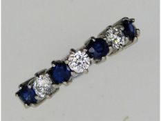 A ladies 9ct white gold half eternity ring set with approx. 0.45ct diamond & sapphire, 2.7g, size N/