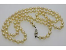A 24in long set of vintage Mikimoto pearls with si