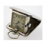 A small silver cased travel clock, winds & runs, 1