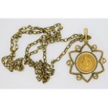 A 9ct gold chain & pendant with a 1945 Dos Pesos c