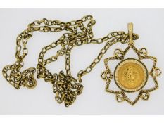 A 9ct gold chain & pendant with a 1945 Dos Pesos c