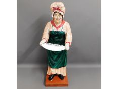 A vintage shop display figure of lady advertising