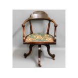 A late 19thC. walnut captains swivel chair, 33.5in