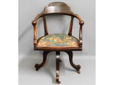 A late 19thC. walnut captains swivel chair, 33.5in