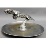 An 'MG Tigress' mascot by Casimir Brau, mounted on a chrome plated dish, Tigress measures 9in, nose