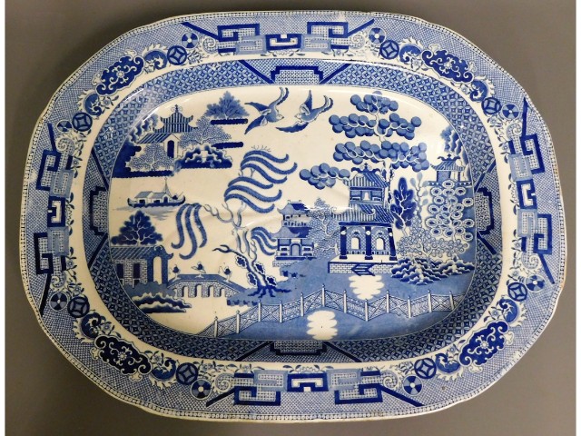 A large 19thC. willow pattern transferware porcela