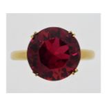 A 14ct gold ring set with ruby coloured paste ston