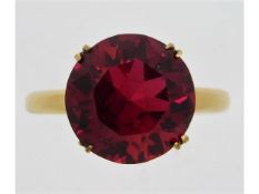 A 14ct gold ring set with ruby coloured paste ston