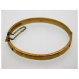 An antique 9ct gold bangle a/f, internal measurement 61 mm wide, 8.8g