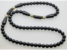 A hematite necklace with faux pearl spacers, 111.8