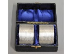 A cased pair of Birmingham silver napkin rings by