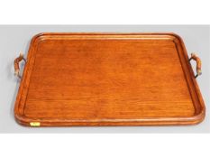 A 1920's oak lap tray with oak & brass handles, 21