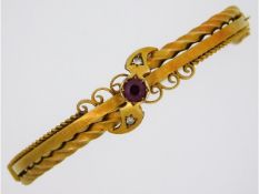 An Edwardian 15ct gold bangle set with two small d