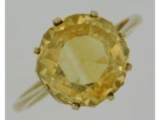 A 9ct gold yellow tanzanite ring, stone 12mm diame