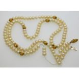 A cultured pearl necklace with 14ct gold fixings &