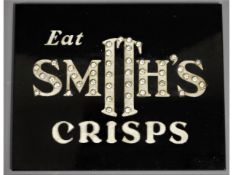 A vintage "Eat Smith's Crisps" bakelite style sign