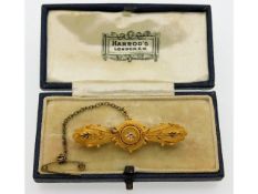 An early 20thC. 15ct gold brooch set with diamond