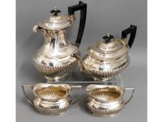 A four piece silver plated coffee & tea set with g