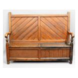 A late 19thC. pitch pine monks bench, one side pan