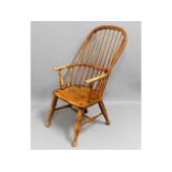 A c.1800 elm sack back Windsor chair, 41in high to