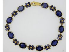 A 9ct gold bracelet set with iolite (water sapphir