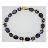 A 9ct gold bracelet set with iolite (water sapphir