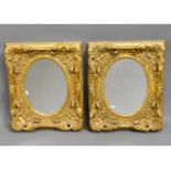 A pair of ornate, decorative gilt mirrors, 24in hi