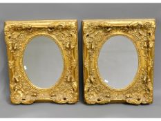 A pair of ornate, decorative gilt mirrors, 24in hi